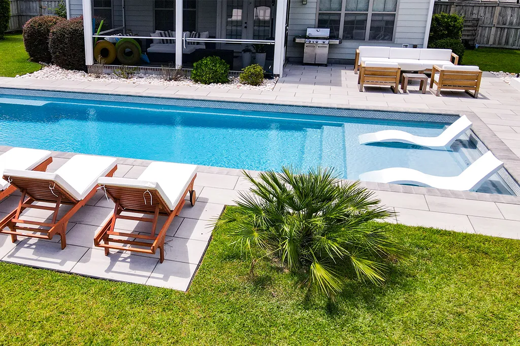 Leisure Pools Wilmington enhances your backyard with custom features